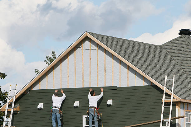 Professional Storm Damage Siding Repair technician working in Bloomingdale, FL